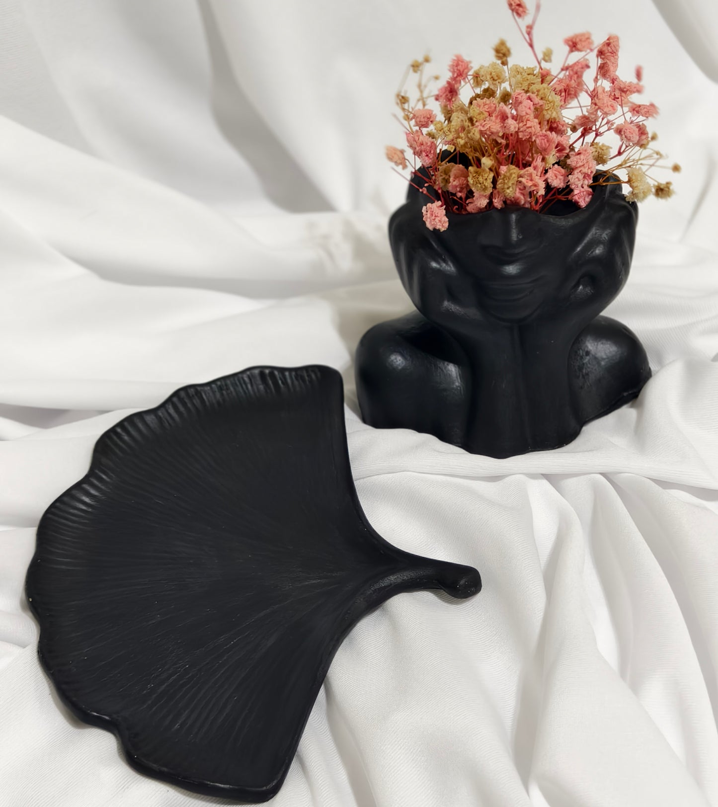 Black face planter with Flowers