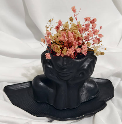 Black face planter with Flowers