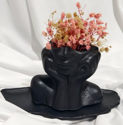Black face planter with Flowers