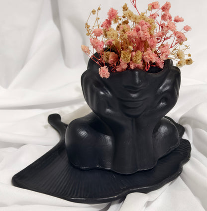 Black face planter with Flowers