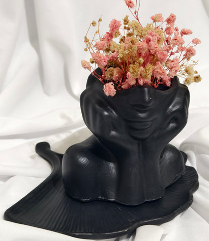Black face planter with Flowers